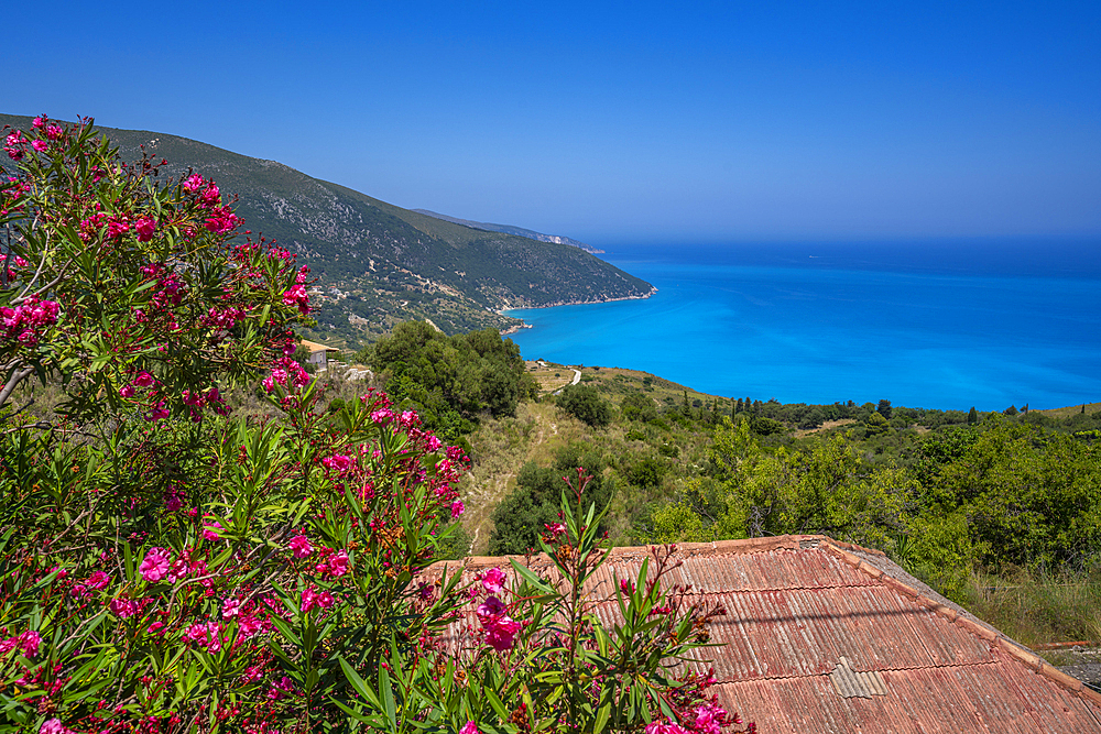 View of houses overlooking coastline, sea and hills near Agkonas, Kefalonia, Ionian Islands, Greek Islands, Greece, Europe