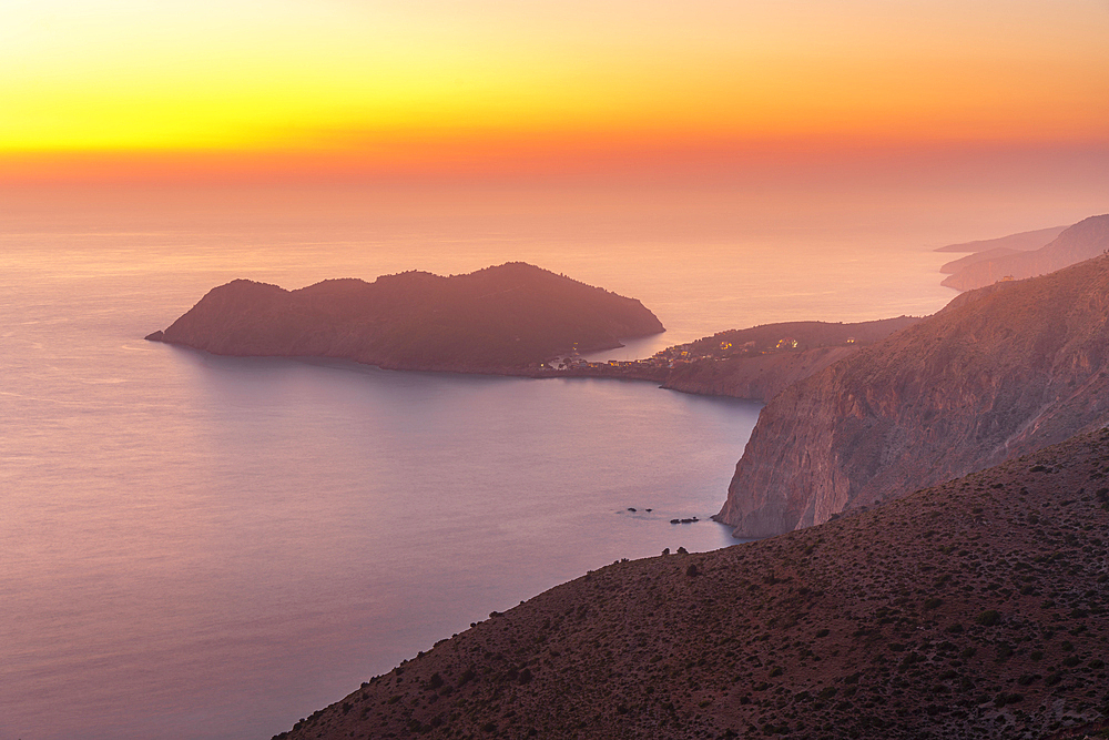 View of Assos, coastline, sea and hills at sunset, Kefalonia, Ionian Islands, Greek Islands, Greece, Europe