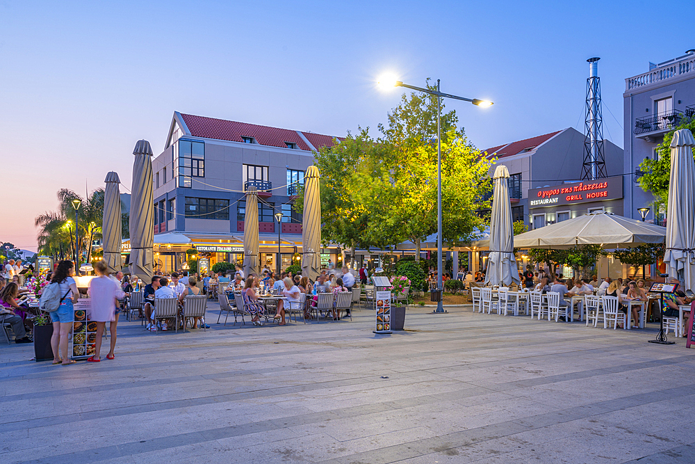 View of restaurant in Vallianou Square at dusk, capital of Cephalonia, Argostolion, Kefalonia, Ionian Islands, Greek Islands, Greece, Europe