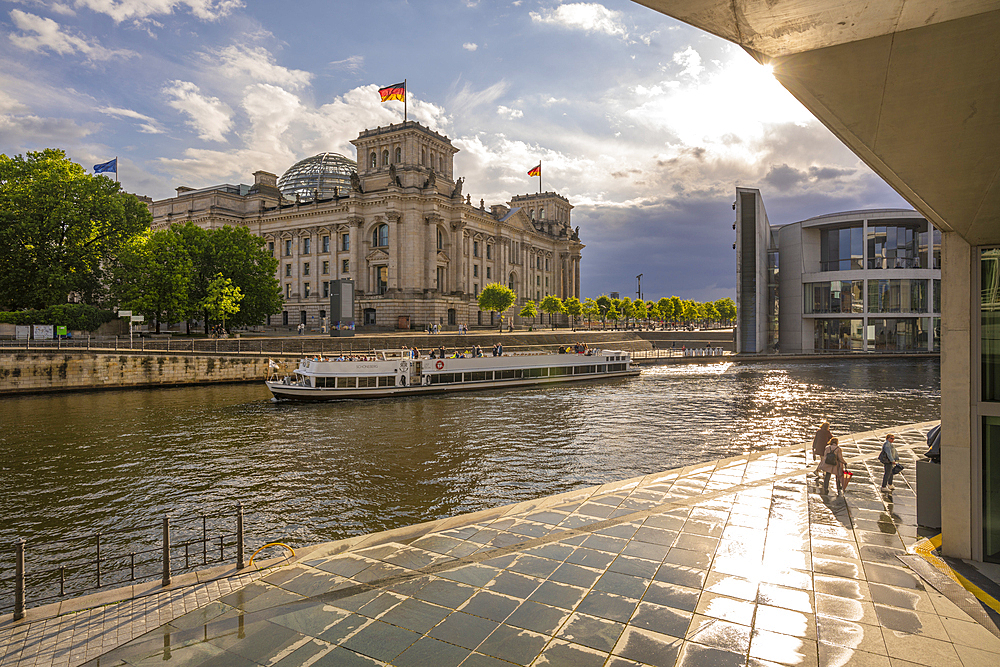 View of sightseeing cruise boat on River Spree and the Reichstag (German Parliament building), Mitte, Berlin, Germany, Europe