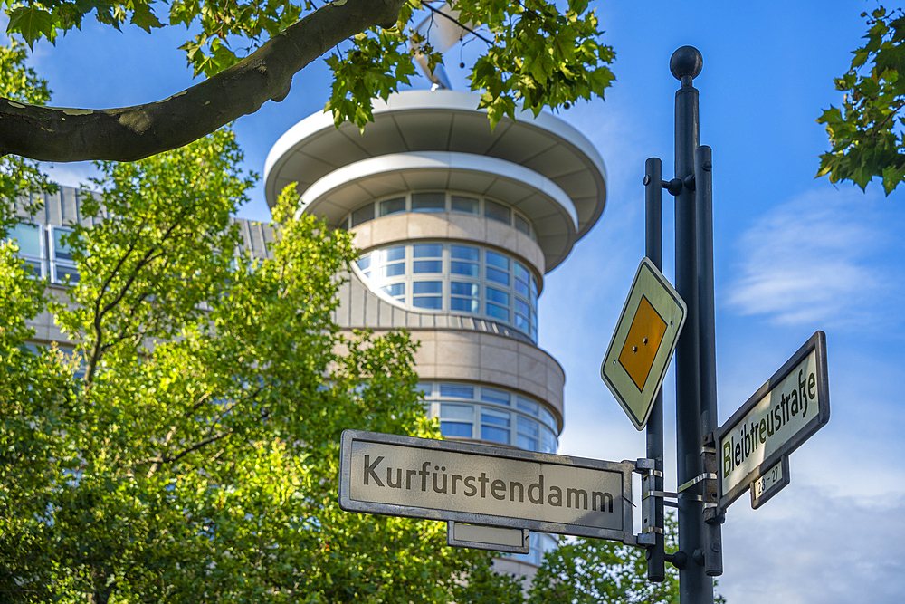 View of sign and building on the tree lined Kurfurstendam in Berlin, Germany, Europe