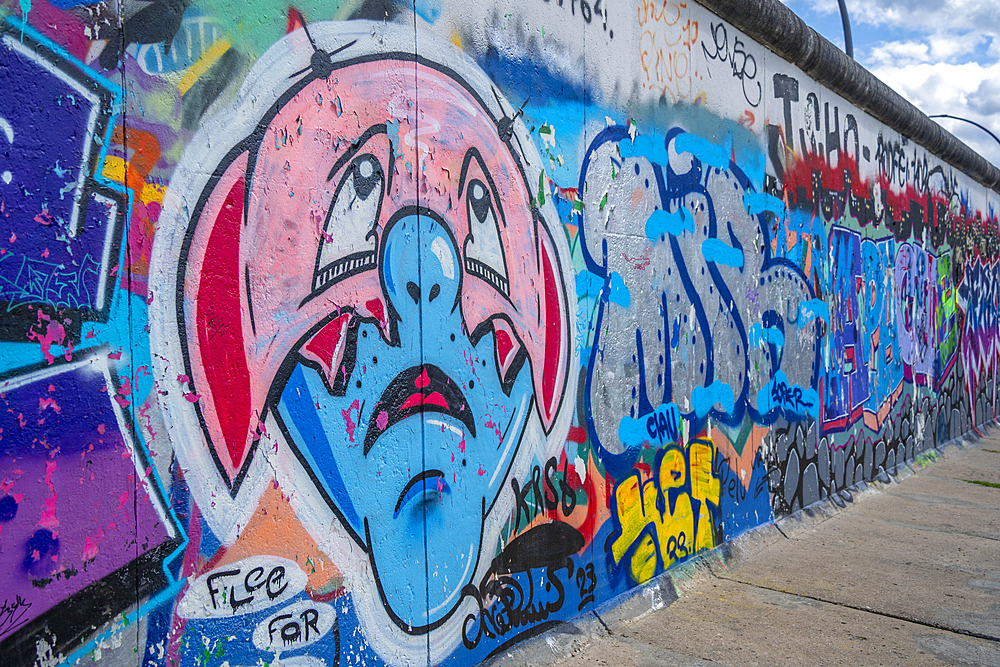 View of artwork at Berliner Mauer, Eastside section of the former Berlin Wall along the Spree River, Berlin, Germany, Europe