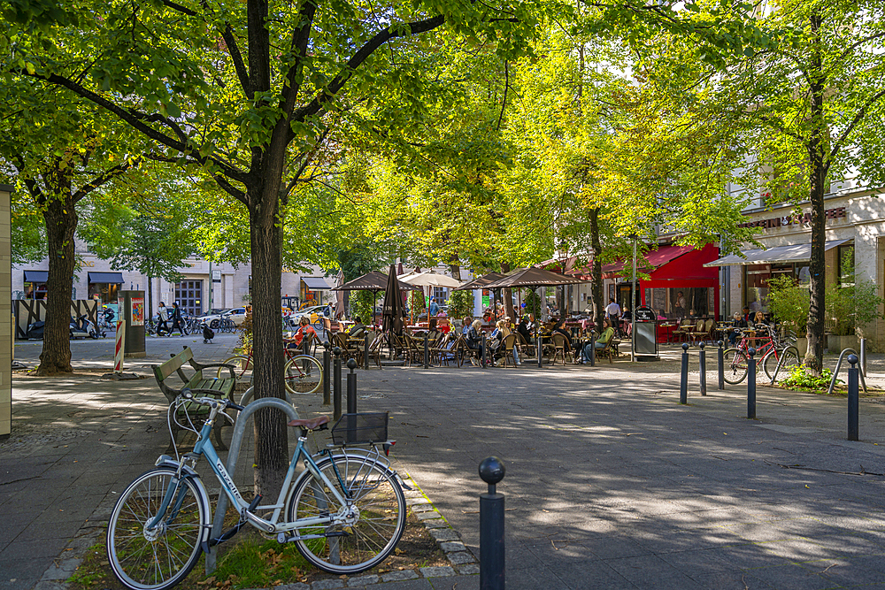 View of restaurant on the tree lined Kurfurstendam in Berlin, Germany, Europe