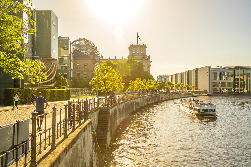 View of sightseeing cruise boat on River Spree and the Reichstag (German Parliament building), Mitte, Berlin, Germany, Europe