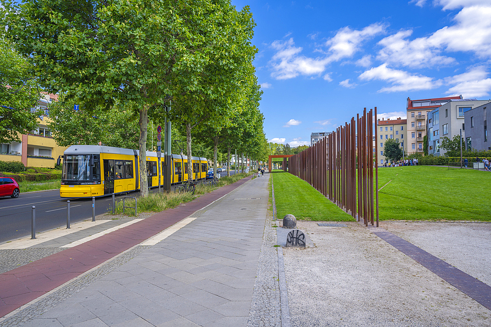 View of yellow city tram at the Berlin Wall Memorial, Memorial Park, Bernauer Strasse, Berlin, Germany, Europe