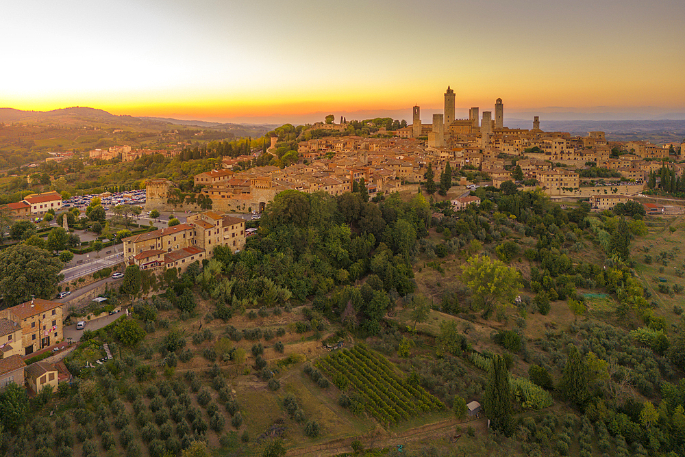 Elevated view of San Gimignano and town at sunset, San Gimignano, Tuscany, Italy, Europe