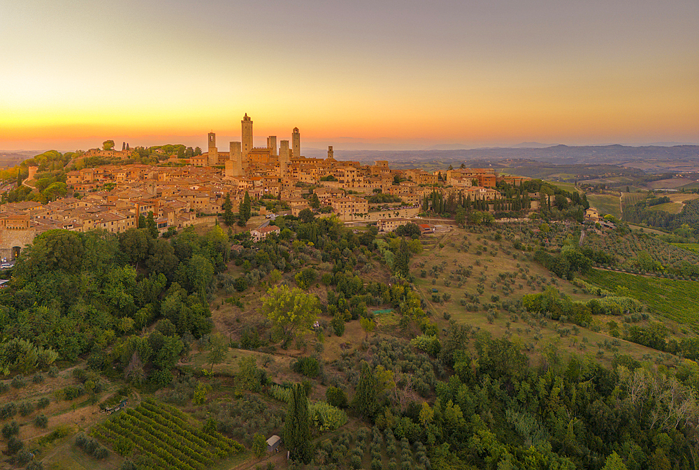 Elevated view of San Gimignano and town at sunset, San Gimignano, Tuscany, Italy, Europe