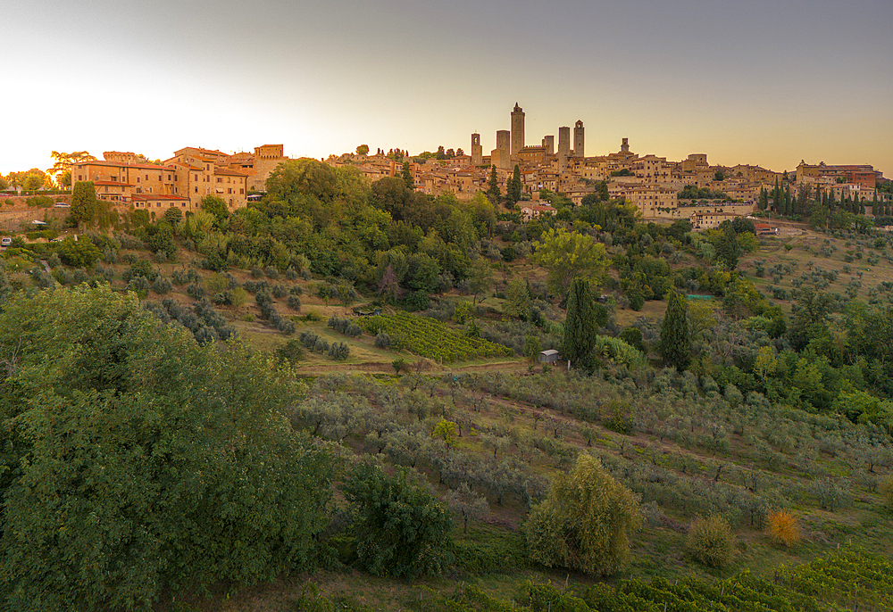 Elevated view of San Gimignano and town at sunset, San Gimignano, Tuscany, Italy, Europe