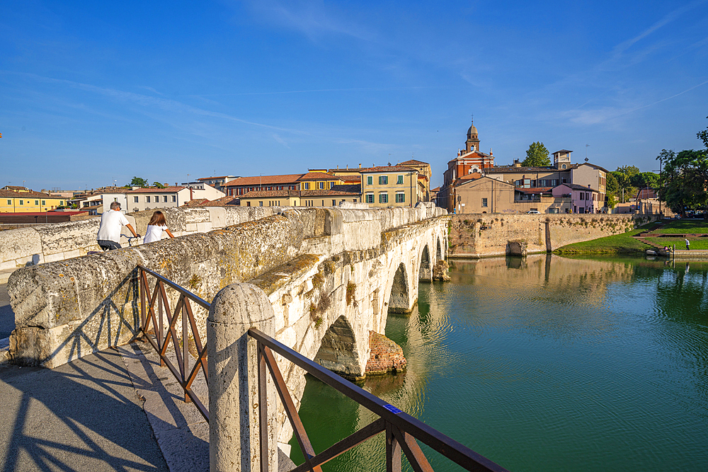 View of Ponte di Tiberio reflecting in Rimini Canal from Borgo San Giuliano, Rimini, Emilia-Romagna, Italy, Europe