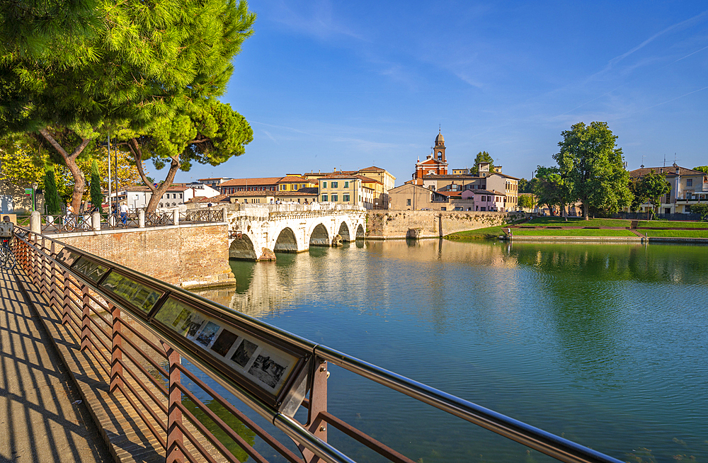 View of Ponte di Tiberio reflecting in Rimini Canal from Borgo San Giuliano, Rimini, Emilia-Romagna, Italy, Europe