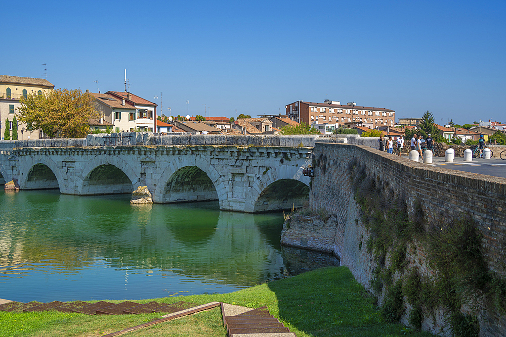 View of Ponte di Tiberio reflecting in Rimini Canal in Borgo San Giuliano district in Rimini, Rimini, Emilia-Romagna, Italy, Europe