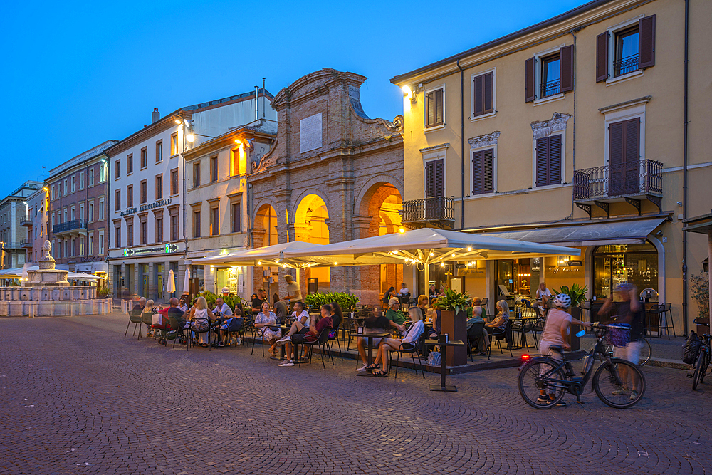 View of restaurant in Piazza Cavour in Rimini at dusk, Rimini, Emilia-Romagna, Italy, Europe