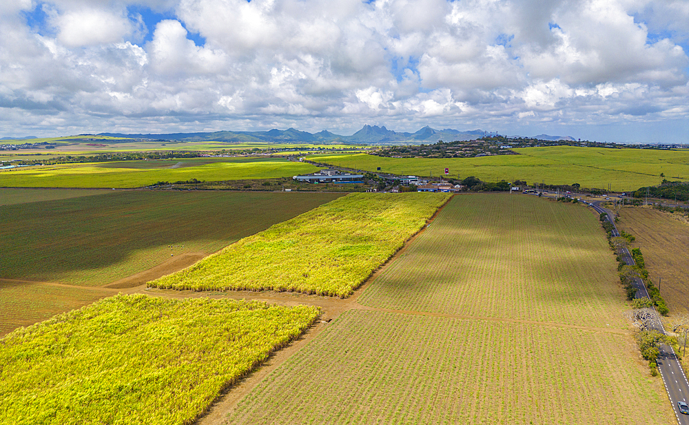 Aerial view of patchwork fields and mountains visible on horizon near Mapou, Rempart District, Mauritius, Indian Ocean, Africa