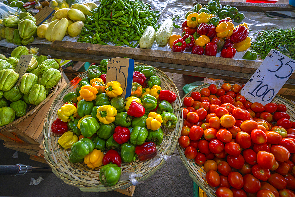 View of fruit stall selling peppers and tomatoes on market near bus station, Port Louis, Mauritius, Indian Ocean, Africa