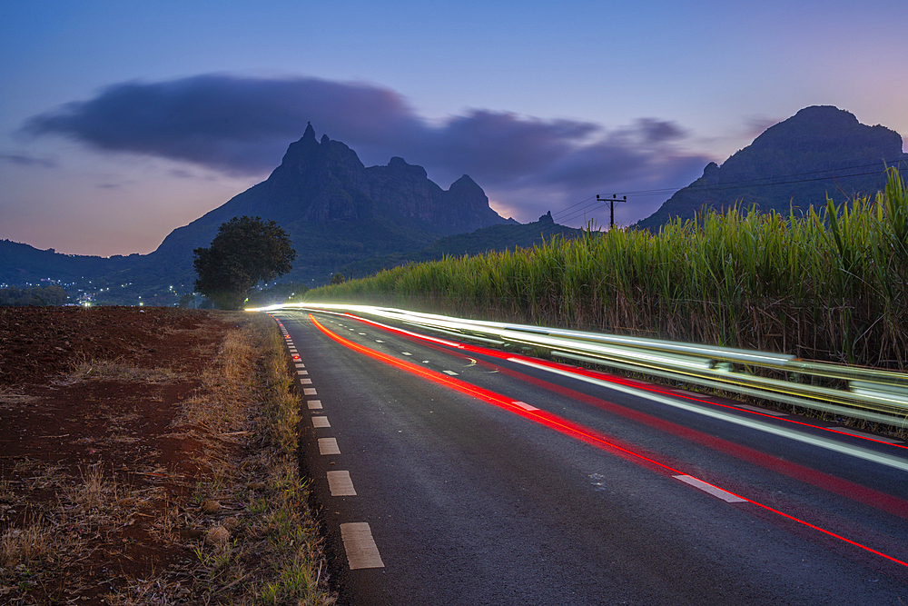 View of trail lights and Long Mountains at dusk near Beau Bois, Mauritius, Indian Ocean, Africa