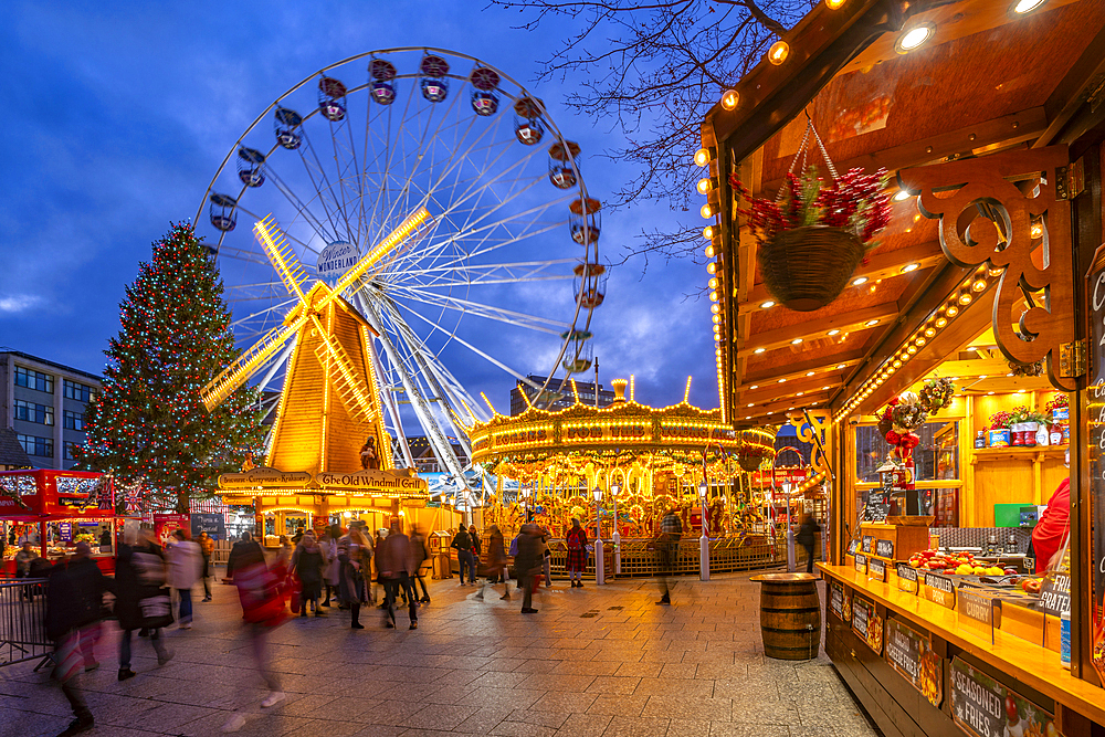 View of ferris wheel and Christmas Market on Old Market Square at dusk, Nottingham, Nottinghamshire, England, United Kingdom, Europe