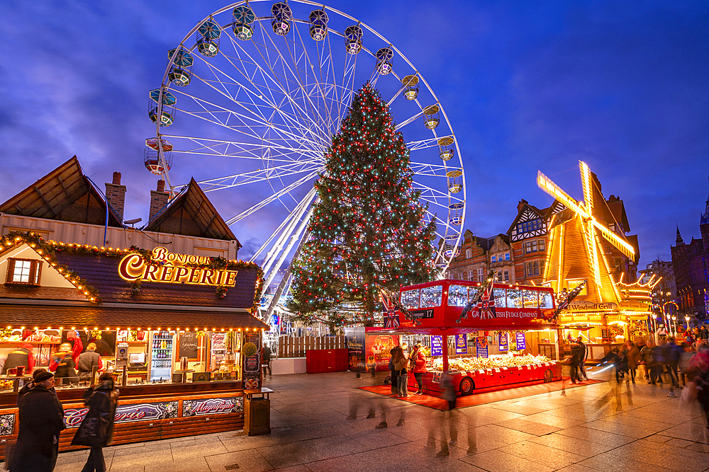 View of ferris wheel and Christmas Market on Old Market Square at dusk, Nottingham, Nottinghamshire, England, United Kingdom, Europe