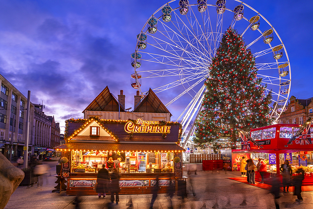 View of ferris wheel and Christmas Market on Old Market Square at dusk, Nottingham, Nottinghamshire, England, United Kingdom, Europe