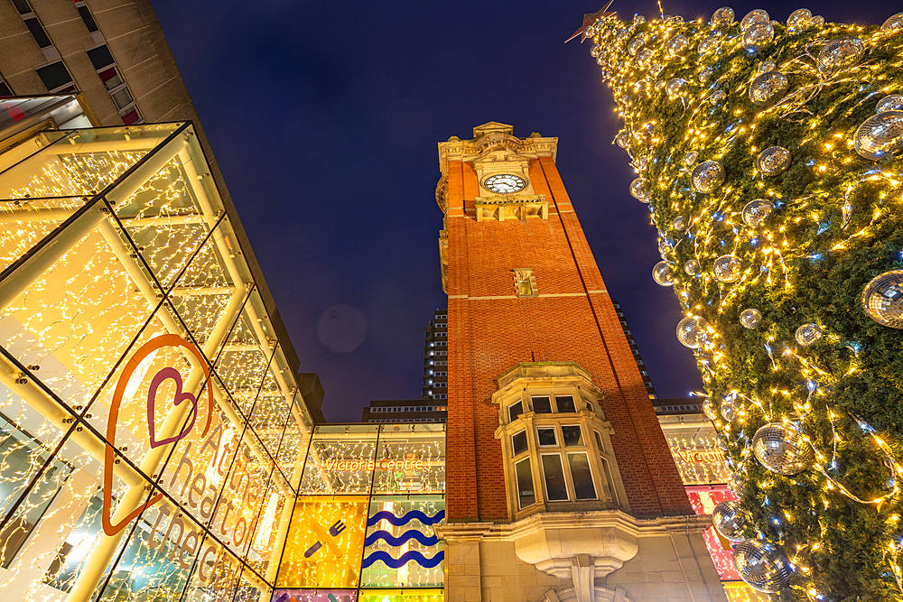 View of Victoria Station Clock Tower and Christmas tree at dusk, Nottingham, Nottinghamshire, England, United Kingdom, Europe