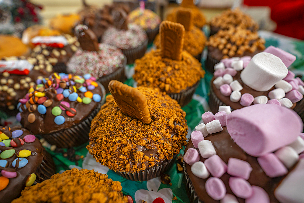 Cakes on Christmas Market stall in Old Market Square at dusk, Nottingham, Nottinghamshire, England, United Kingdom, Europe