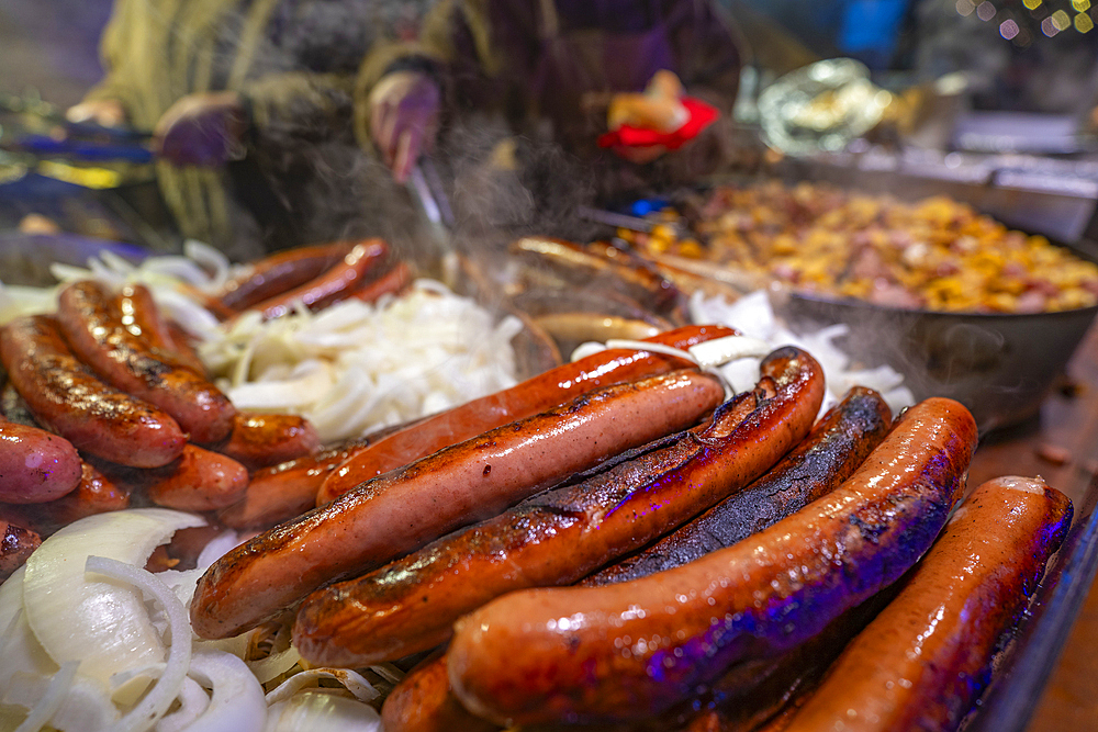 Frankfurter sausages on Christmas Market stall in Old Market Square at dusk, Nottingham, Nottinghamshire, England, United Kingdom, Europe