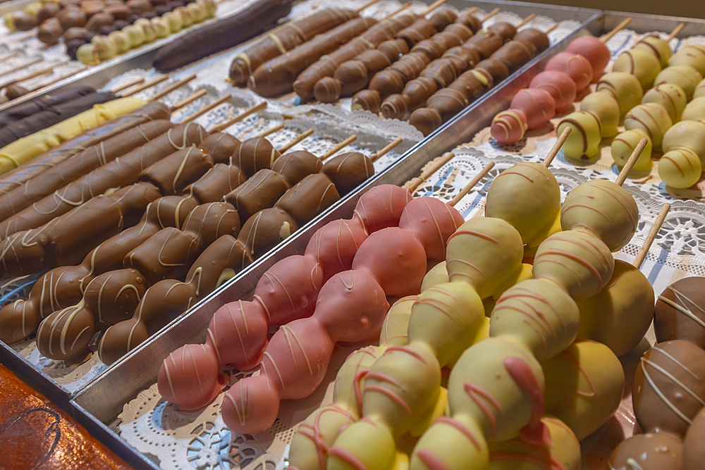 View of chocolates on Christmas Market stall in Victoria Square at dusk, Birmingham, West Midlands, England, United Kingdom, Europe