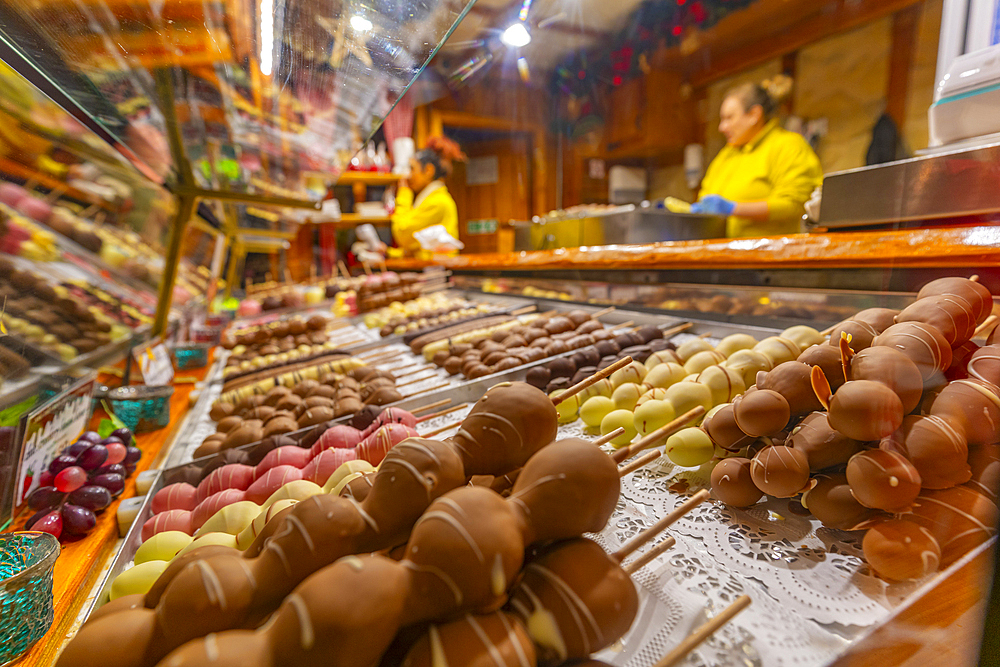 View of chocolates on Christmas Market stall in Victoria Square at dusk, Birmingham, West Midlands, England, United Kingdom, Europe