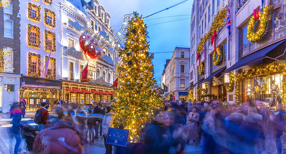 View of New Bond Street Christmas tree and shops at Christmas, Westminster, London, England, United Kingdom, Europe