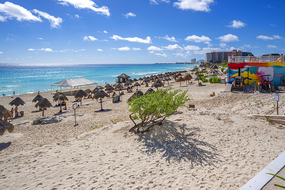 View of long white sandy beach at Playa Delfines, Hotel Zone, Cancun, Caribbean Coast, Yucatan Peninsula, Mexico, North America