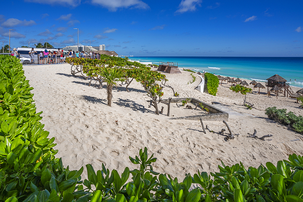 View of long white sandy beach at Playa Delfines, Hotel Zone, Cancun, Caribbean Coast, Yucatan Peninsula, Mexico, North America