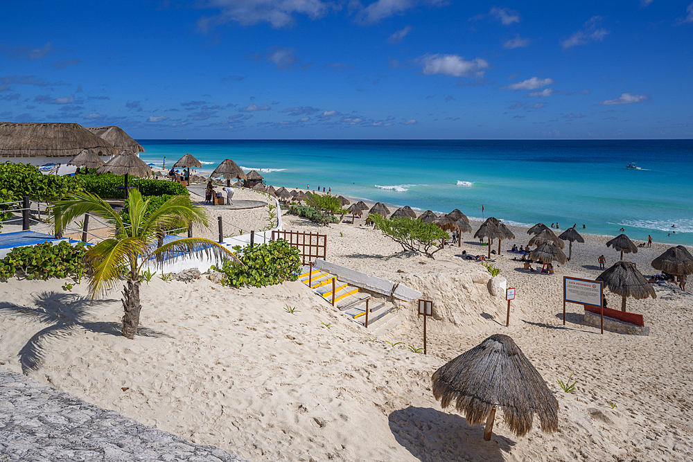 View of long white sandy beach at Playa Delfines, Hotel Zone, Cancun, Caribbean Coast, Yucatan Peninsula, Mexico, North America