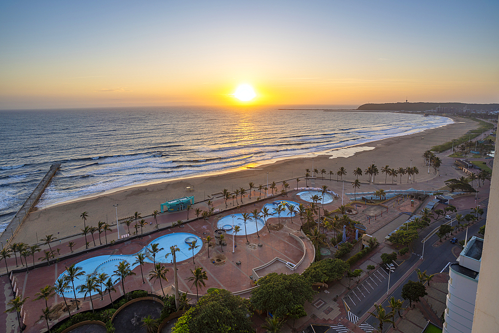 Elevated view of beaches, promenade and Indian Ocean at sunrise, Durban, KwaZulu-Natal Province, South Africa, Africa