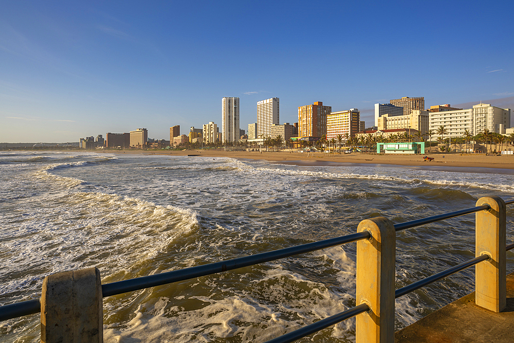 View of promenade, beach and hotels from pier in Indian Ocean at sunrise, Durban, KwaZulu-Natal Province, South Africa, Africa