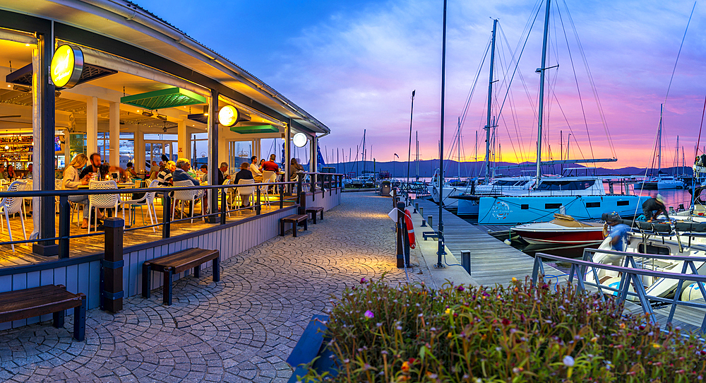 View of golden sunset, boats and restaurants at Knysna Waterfront, Knysna, Western Cape Province, South Africa, Africa