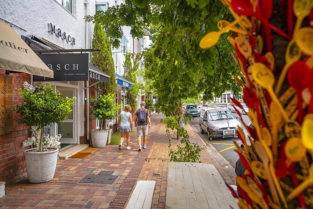 View of couple walking in street, Stellenbosch Central, Stellenbosch, Western Cape, South Africa, Africa