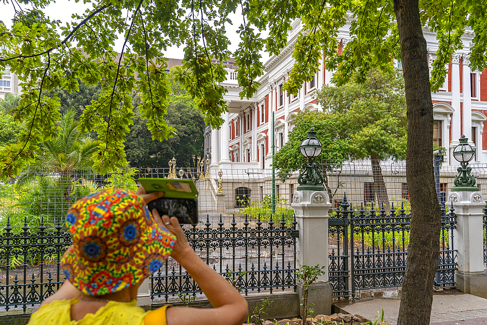 View of woman taking mobile phone picture of Parliament of South Africa, Cape Town, Western Cape, South Africa, Africa