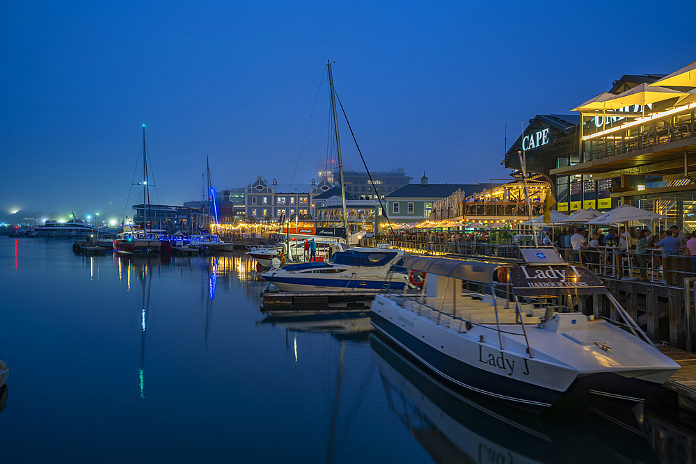 View of boats and restaurants in the Waterfront at dusk, Cape Town, Western Cape, South Africa, Africa