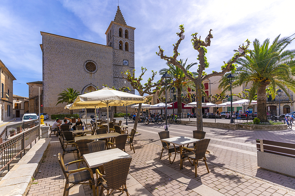 View of cafe and church in Placa Mayor in hilltop town of Campanet, Majorca, Balearic Islands, Spain, Mediterranean, Europe