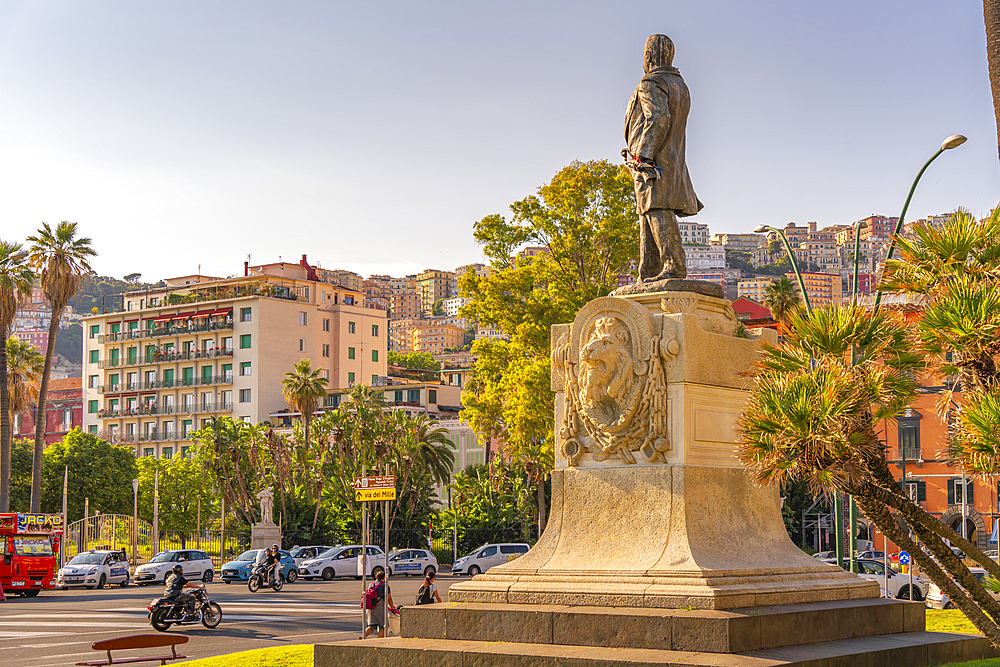 View of Giovanni Nicotera statue and colourful architecture in Piazza della Vittoria, Naples, Campania, Italy, Europe