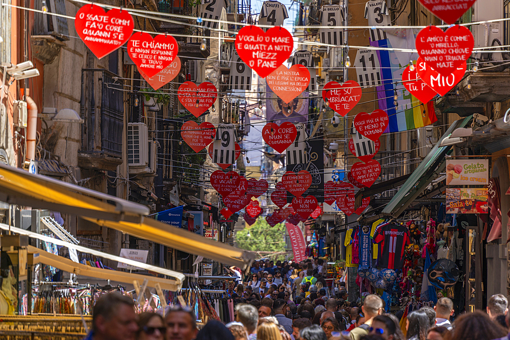 View of shops and decor on bustling Via San Biagio Dei Librai, Naples, Campania, Italy, Europe