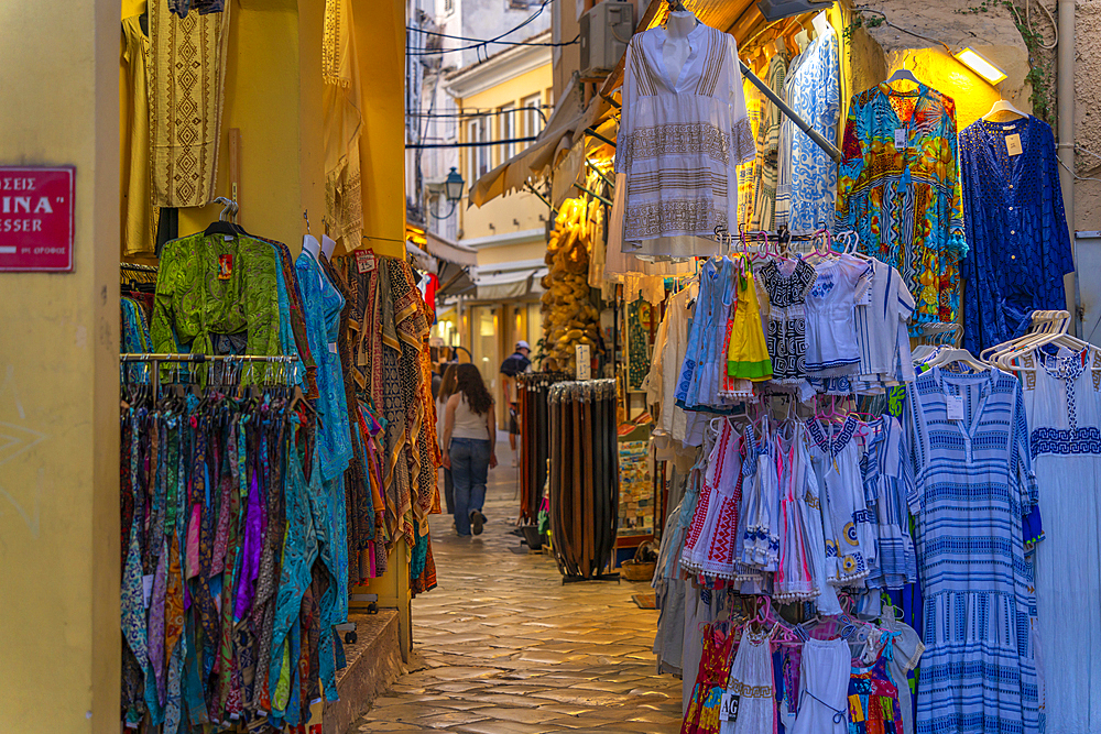 View of shops in old Corfu Town at dusk, Corfu, Ionian Sea, Greek Islands, Greece, Europe