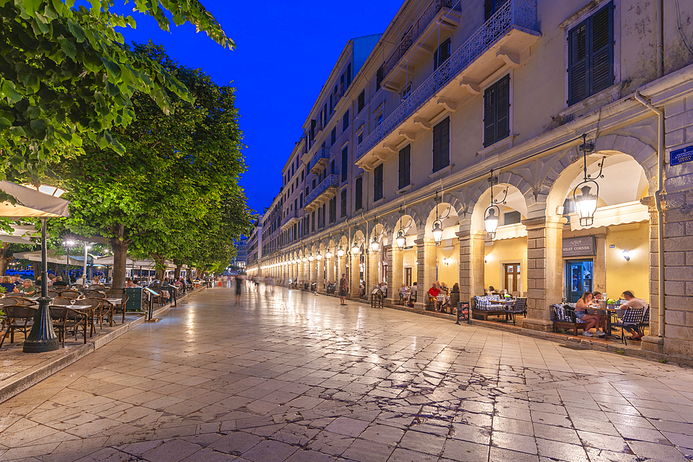 View of buildings and restaurants on the Liston Esplanade at dusk, Corfu Old Town, UNESCO World Heritage Site, Corfu, The Ionian Islands, Greek Islands, Greece, Europe