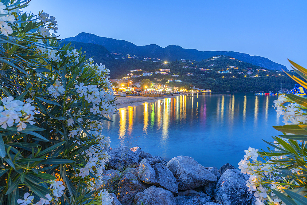 View of Ionian Sea and Ipsos Beach in Ipsos at dusk, Ipsos, Corfu, Ionian Sea, Greek Islands, Greece, Europe