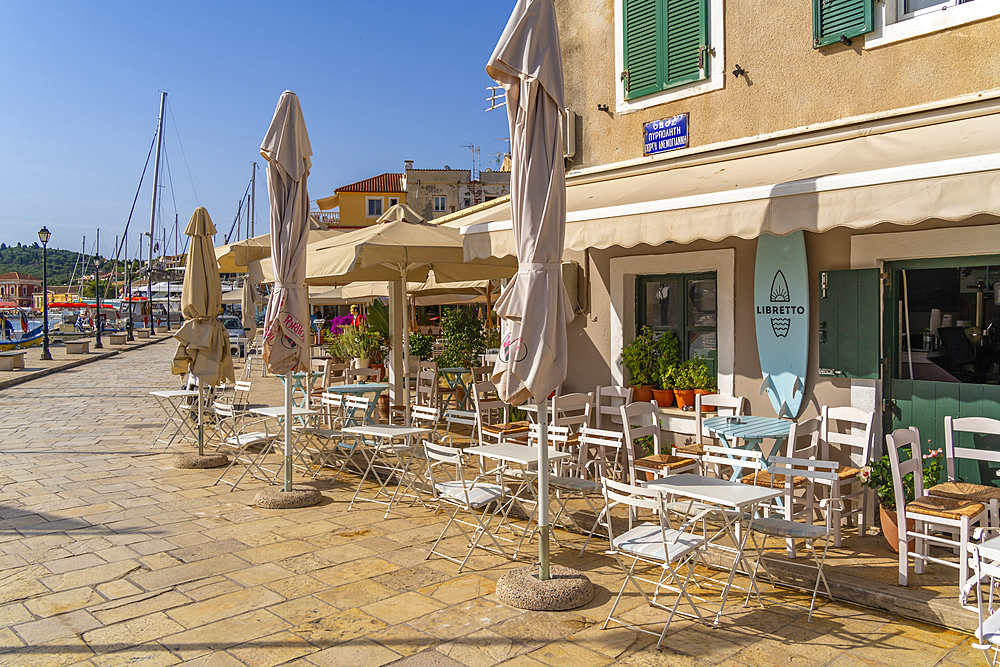 View of boats and cafes in the harbour in Gaios Town, Paxos, Ionian Sea, Greek Islands, Greece, Europe