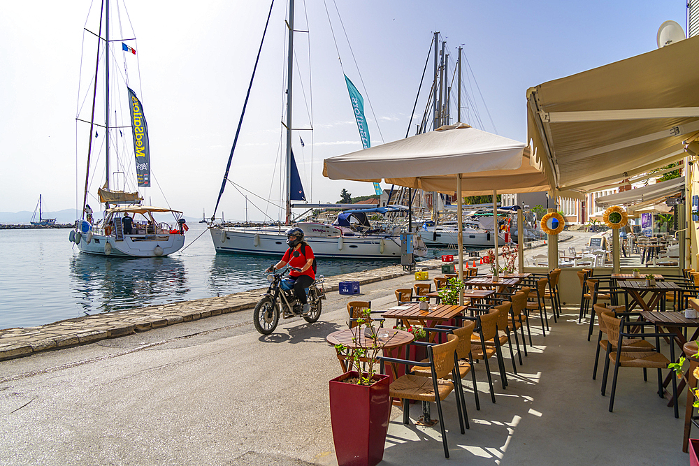 View of boats and cafes in the harbour in Gaios Town, Paxos, Ionian Sea, Greek Islands, Greece, Europe