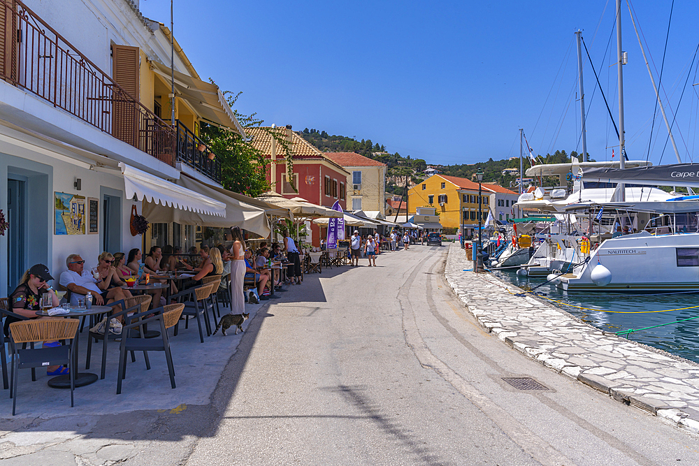 View of boats and cafes in the harbour in Gaios Town, Paxos, Ionian Sea, Greek Islands, Greece, Europe