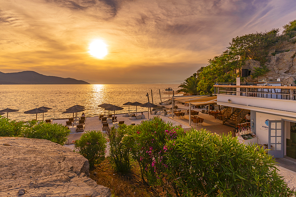 View of beach bar and sea at sunset in Thassos Town, Thassos, Aegean Sea, Greek Islands, Greece, Europe