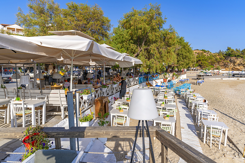 View of restaurants and cafes overlooking beach at Limenaria, Limenaria, Thassos, Aegean Sea, Greek Islands, Greece, Europe