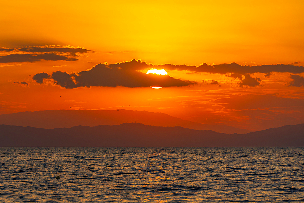 View of sunset and Aegean Sea from Thassos Town, Thassos, Aegean Sea, Greek Islands, Greece, Europe