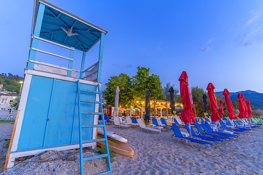 View of lifeguard tower and sun loungers on beach after sunset, Thassos Town, Thassos, Aegean Sea, Greek Islands, Greece, Europe